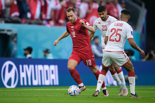 Christian Eriksen of Denmark against Mohamed Drager and