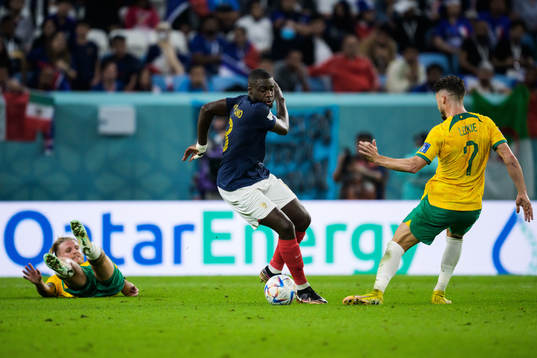 Jason Cummings and Mathew Leckie of Australia in action