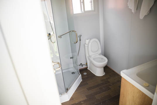 A bathroom in a room at Fan Village Cabins Free Zone
