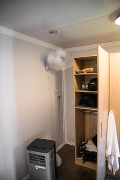 A fan and air cooling device in a room at Fan Village