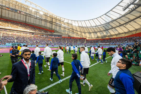 Players of Germany and Japan enters the pitch