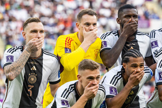 David Raum and goalkeeper Manuel Neuer of Germany hold