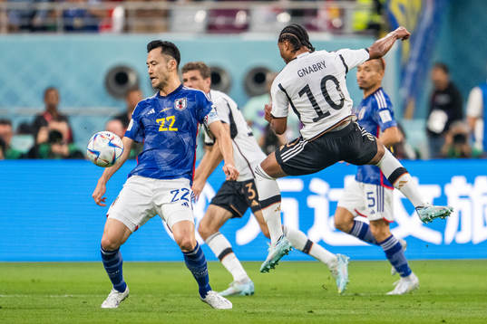 Maya Yoshida of Japan and Serge Gnabry of Germany