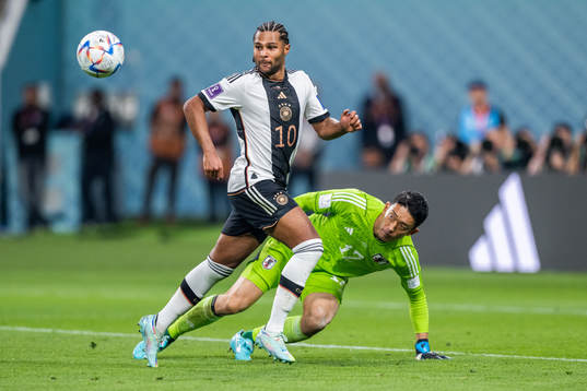 Serge Gnabry of Germany and goalkeeper Shuichi Gonda of