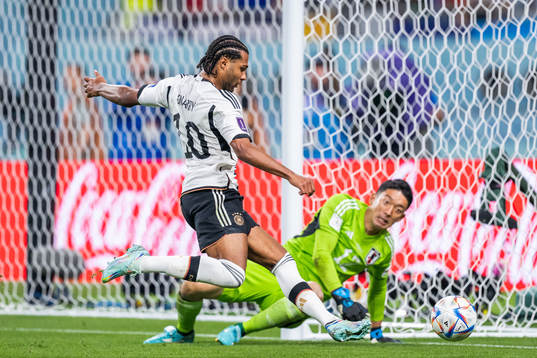 Serge Gnabry of Germany and goalkeeper Shuichi Gonda of