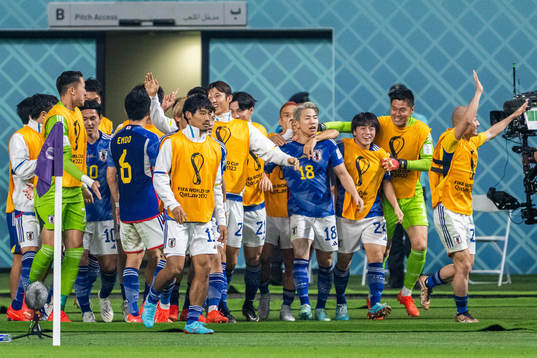 Takuma Asano of Japan celebrates
