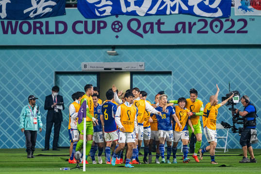 Takuma Asano of Japan celebrates