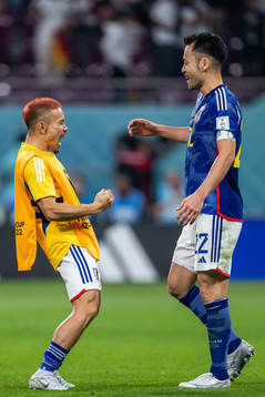 Yuto Nagatomo and Maya Yoshida of Japan celebrate
