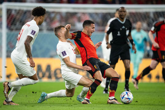 Alistair Johnston of Canada and Eden Hazard of Belgium