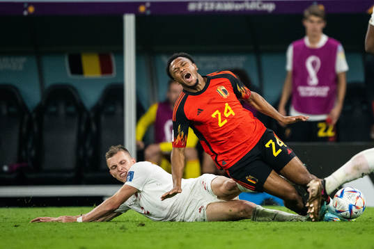 Alistair Johnston of Canada tackles Lois Openda of Belgium