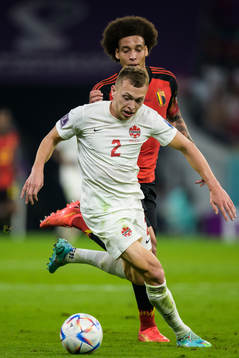 Alistair Johnston of Canada and Axel Witsel of Belgium