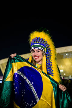 A Brazilian fan poses for a portrait