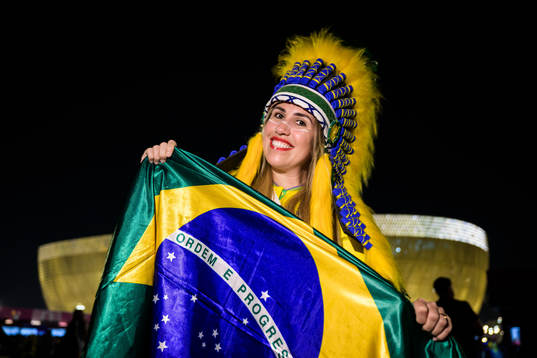 A Brazilian fan poses for a portrait