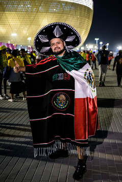 A Mexican fan poses for a portrait