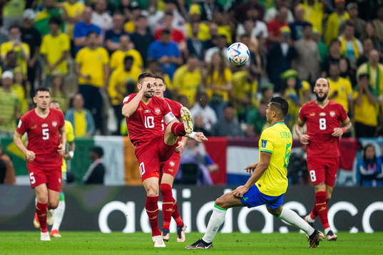 Dusan Tadic of Serbia and Casemiro of Brazil