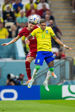 Filip Mladenovic of Serbia and Raphinha of Brazil