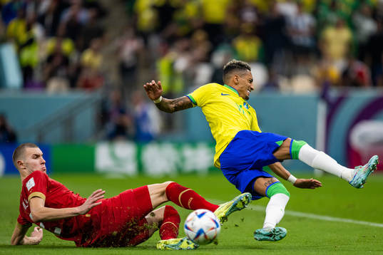Strahinja Pavlovic of Serbia and Raphinha of Brazil