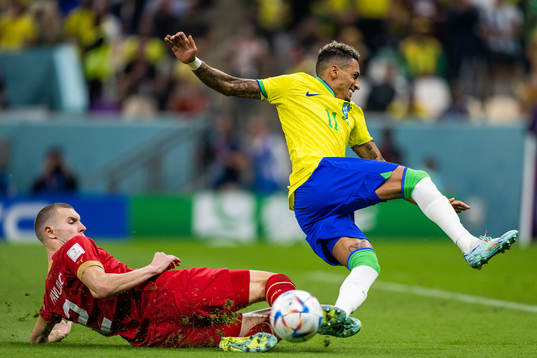 Strahinja Pavlovic of Serbia and Raphinha of Brazil