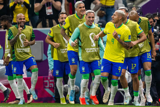 Richarlison of Brazil celebrates with team mates
