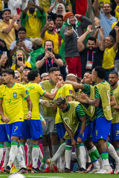 Richarlison of Brazil celebrates with team mates