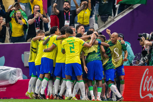 Richarlison of Brazil celebrates with team mates
