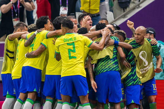 Richarlison of Brazil celebrates with team mates