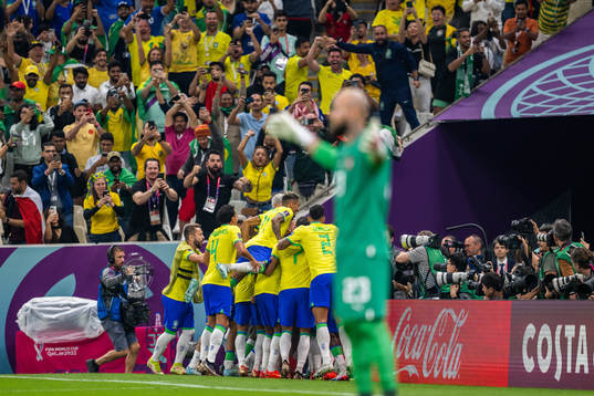 Richarlison of Brazil celebrates with team mates
