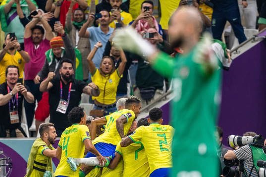 Richarlison of Brazil celebrates with team mates
