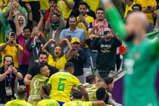 Richarlison of Brazil celebrates with team mates