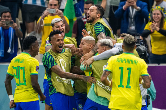 Richarlison of Brazil celebrates with team mates