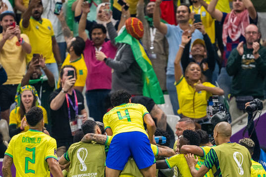 Richarlison of Brazil celebrates with team mates