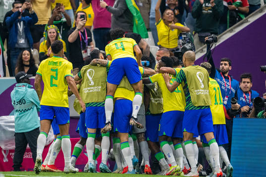 Richarlison of Brazil celebrates with team mates