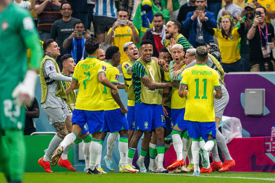 Richarlison of Brazil celebrates with team mates