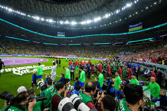 Players of Brazil and of Serbia enter the field for the