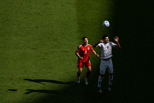Harry Wilson of Wales and Saeid Ezatolahi of Iran