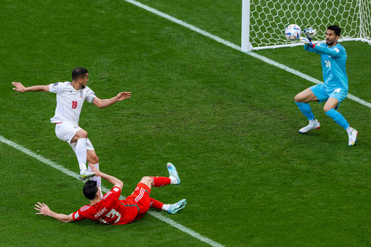 Majid Hosseini and goalkeeper Hossein Hosseini of Iran