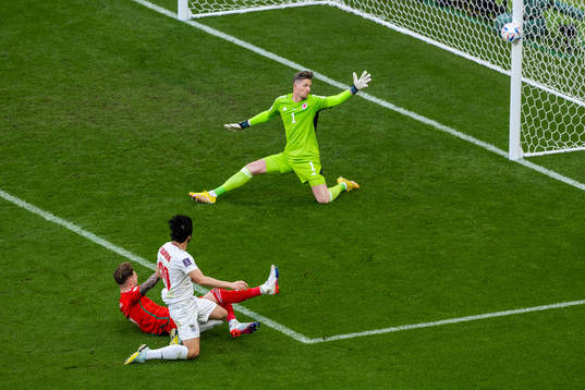 goalkeeper Wayne Hennessey of Wales see Sardar Azmoun of