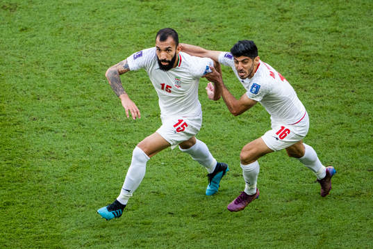 Rouzbeh Cheshmi and Mehdi Torabi of Iran celebrate
