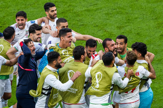 Rouzbeh Cheshmi of Iran celebrates with team mates