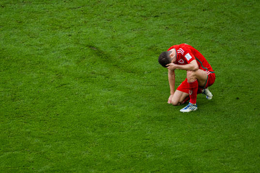 Ben Davies of Wales looks dejected