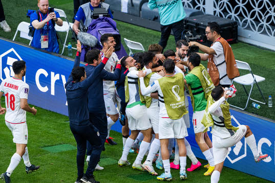 Ramin Rezaeian of Iran celebrates with team mates
