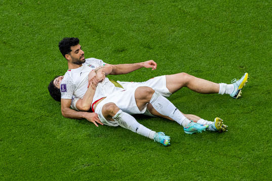 Sardar Azmoun and Mehdi Taremi of Iran celebrate