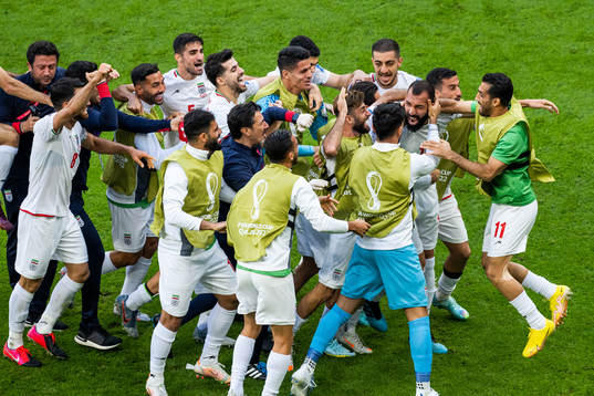 Rouzbeh Cheshmi of Iran celebrates with team mates