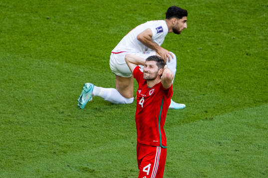 Ben Davies of Wales  looks dejected