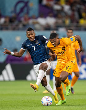 Pervis Estupinan of Ecuador against Denzel Dumfries of