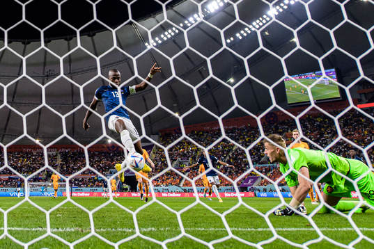 Enner Valencia of Ecuador scores 1-1 behind goalkeeper