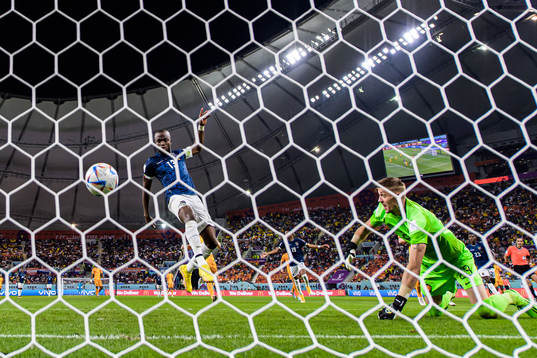 Enner Valencia of Ecuador scores 1-1 behind goalkeeper