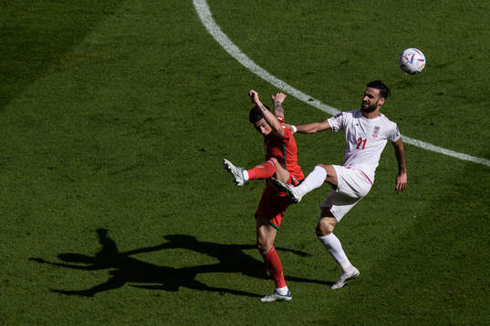 Harry Wilson of Wales and Ahmad Noorollahi of Iran