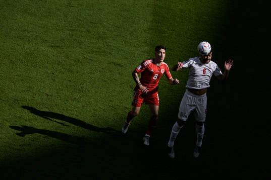 Harry Wilson of Wales and Saeid Ezatolahi of Iran