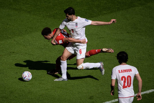 Ethan Ampadu of Wales and Saeid Ezatolahi of Iran